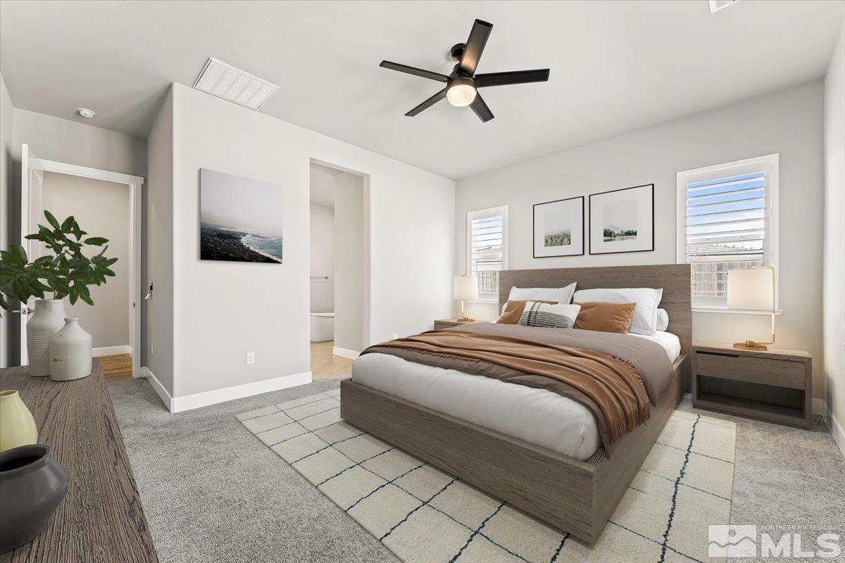 1273 Crawford Crk Drive Reno, NV 89521 - Photo 15 of 39 a spacious bedroom with a bed and a potted plant