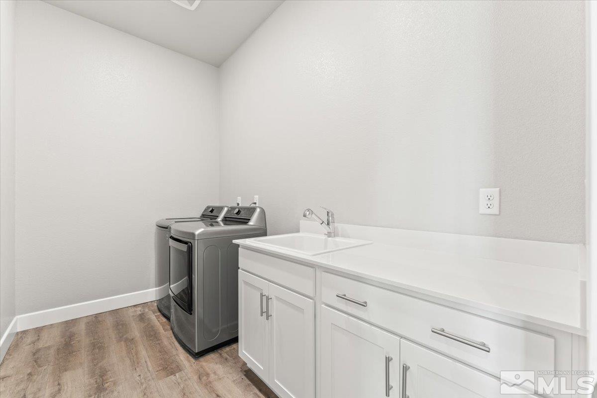 1273 Crawford Crk Drive Reno, NV 89521 - Photo 25 of 39 a utility room with a sink washer and dryer