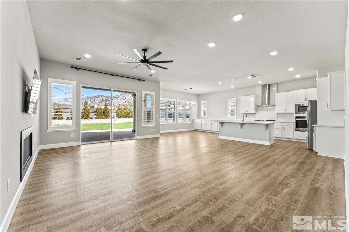 1273 Crawford Crk Drive Reno, NV 89521 - Photo 3 of 39 a view of kitchen with furniture and wooden floor
