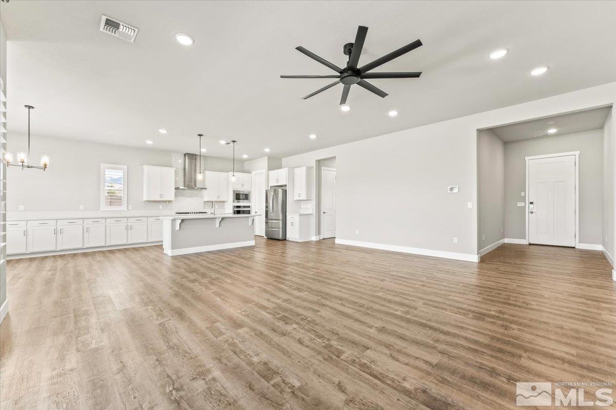 1273 Crawford Crk Drive Reno, NV 89521 - Photo 5 of 39 a view of a kitchen with a sink and wooden floor