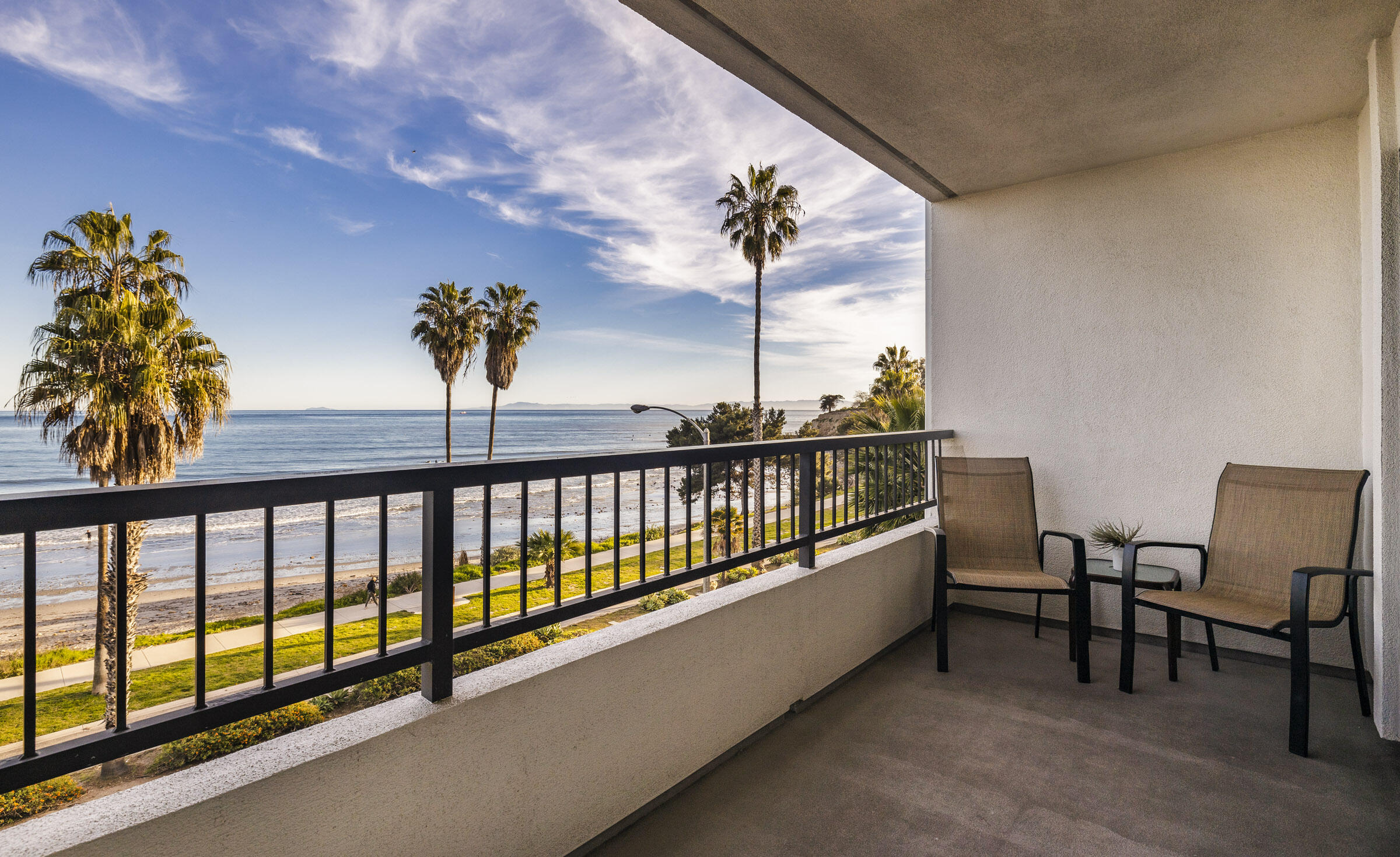 a view of a balcony with chairs