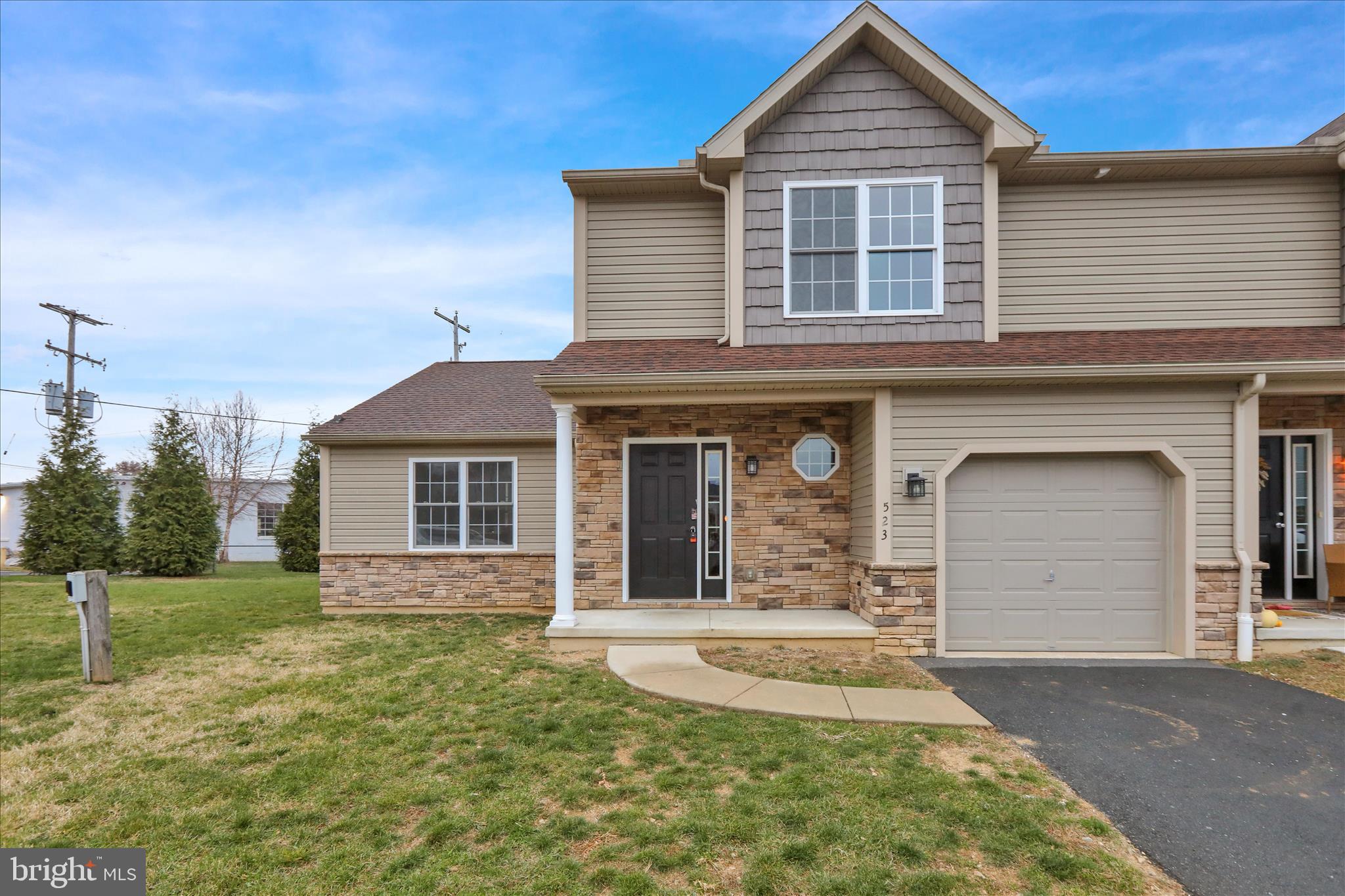 front view of a house with a yard