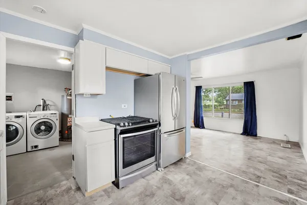 a view of a kitchen with washer and dryer