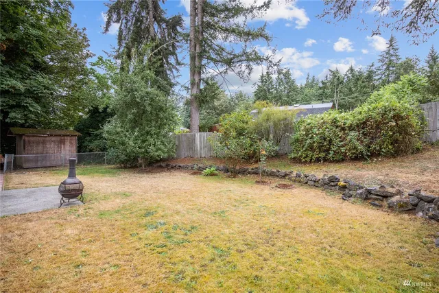 a backyard of a house with lots of green space