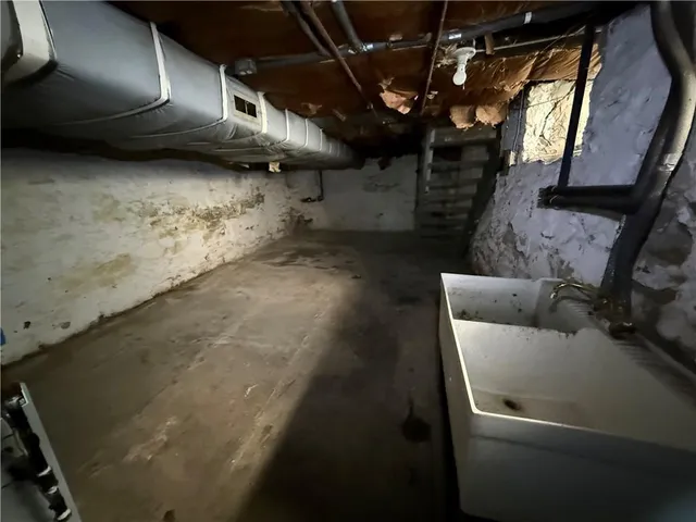 a view of garage with a car parked in garage