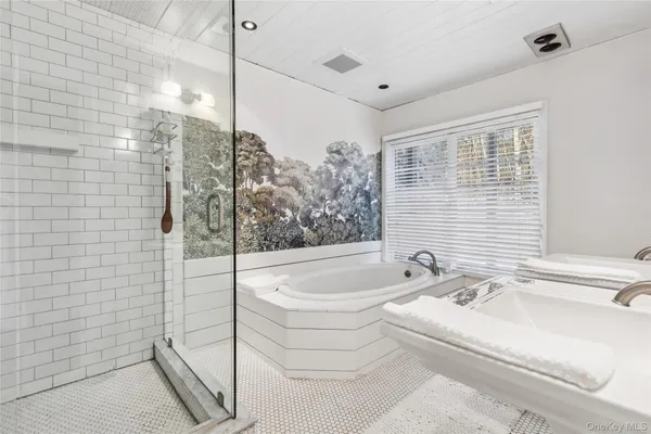 a living room with furniture and large windows