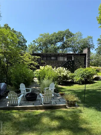 a view of a tree with a yard