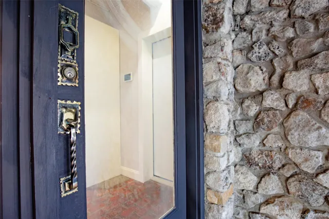 a picture of a room with a white wall and white cabinet