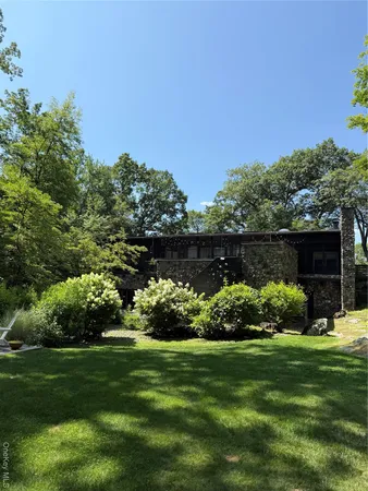 a front view of a house with a large window