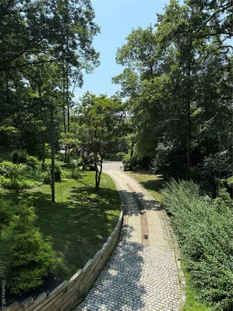 a view of a chairs and table in the back yard