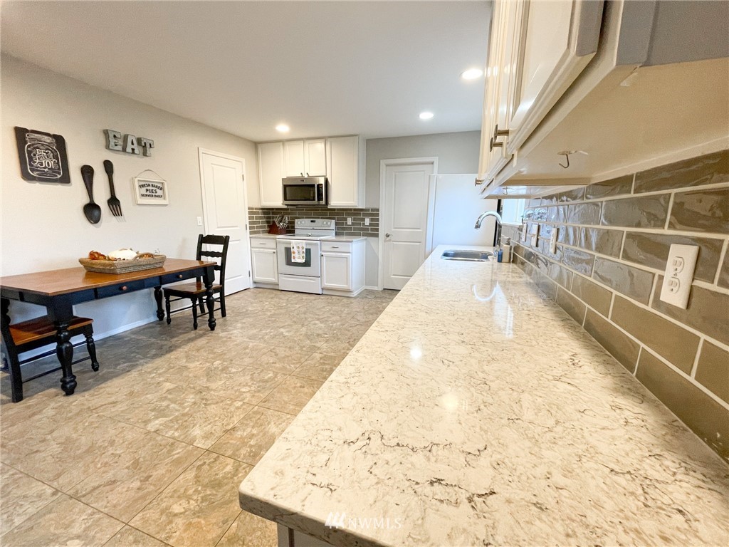 20536 Corbridge Road Southeast Monroe, WA 98272 - Photo 8 of 20 a view of kitchen with cabinets