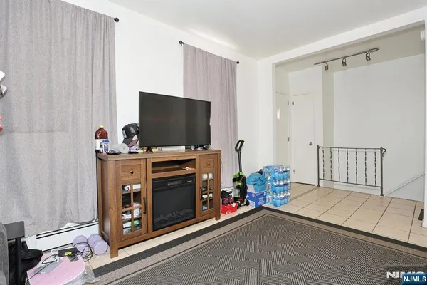 a room with furniture and flat screen tv