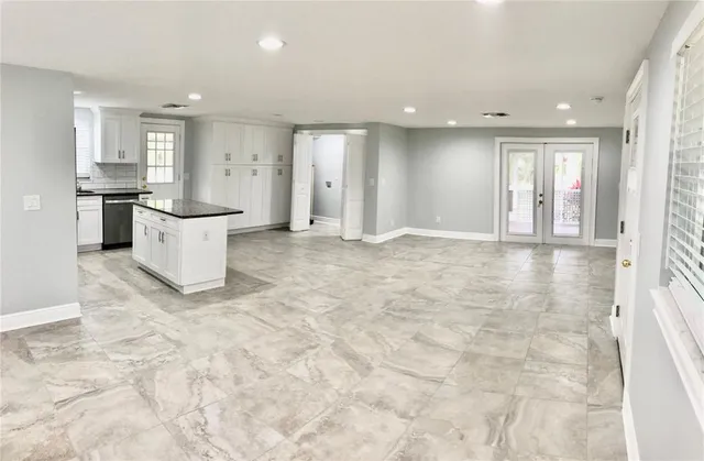 a view of a kitchen with a sink and cabinets