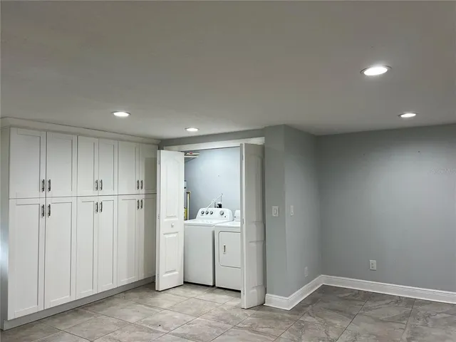 a view of a storage & utility room with a sink