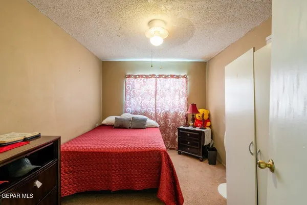 a bedroom with a bed and a closet