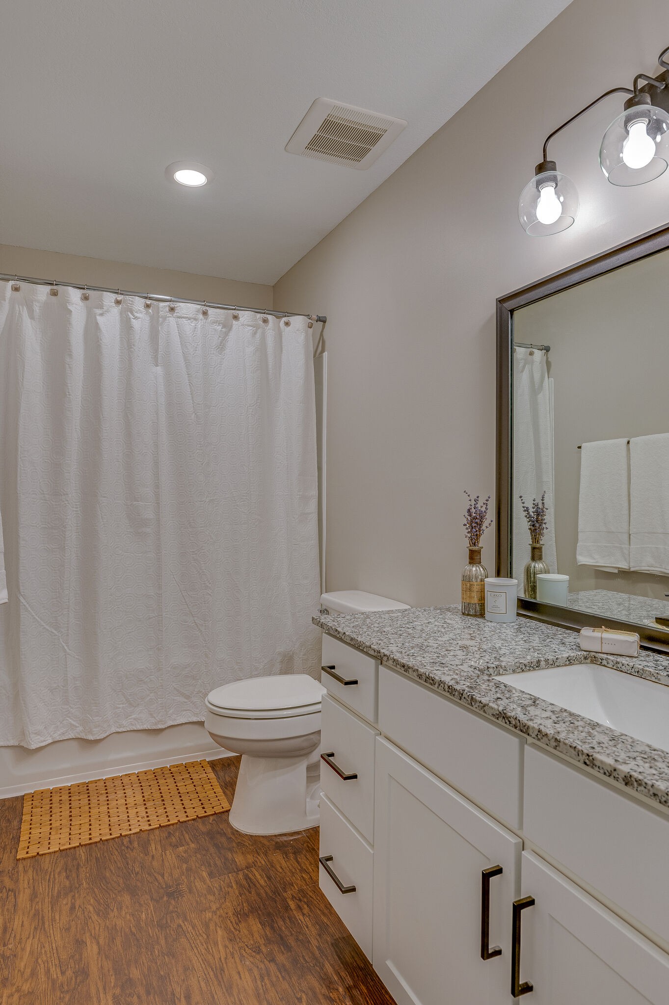 1301 Neelys Bend Road, Unit 90 Madison, TN 37115 - Photo 15 of 17 a bathroom with a granite countertop sink and a toilet