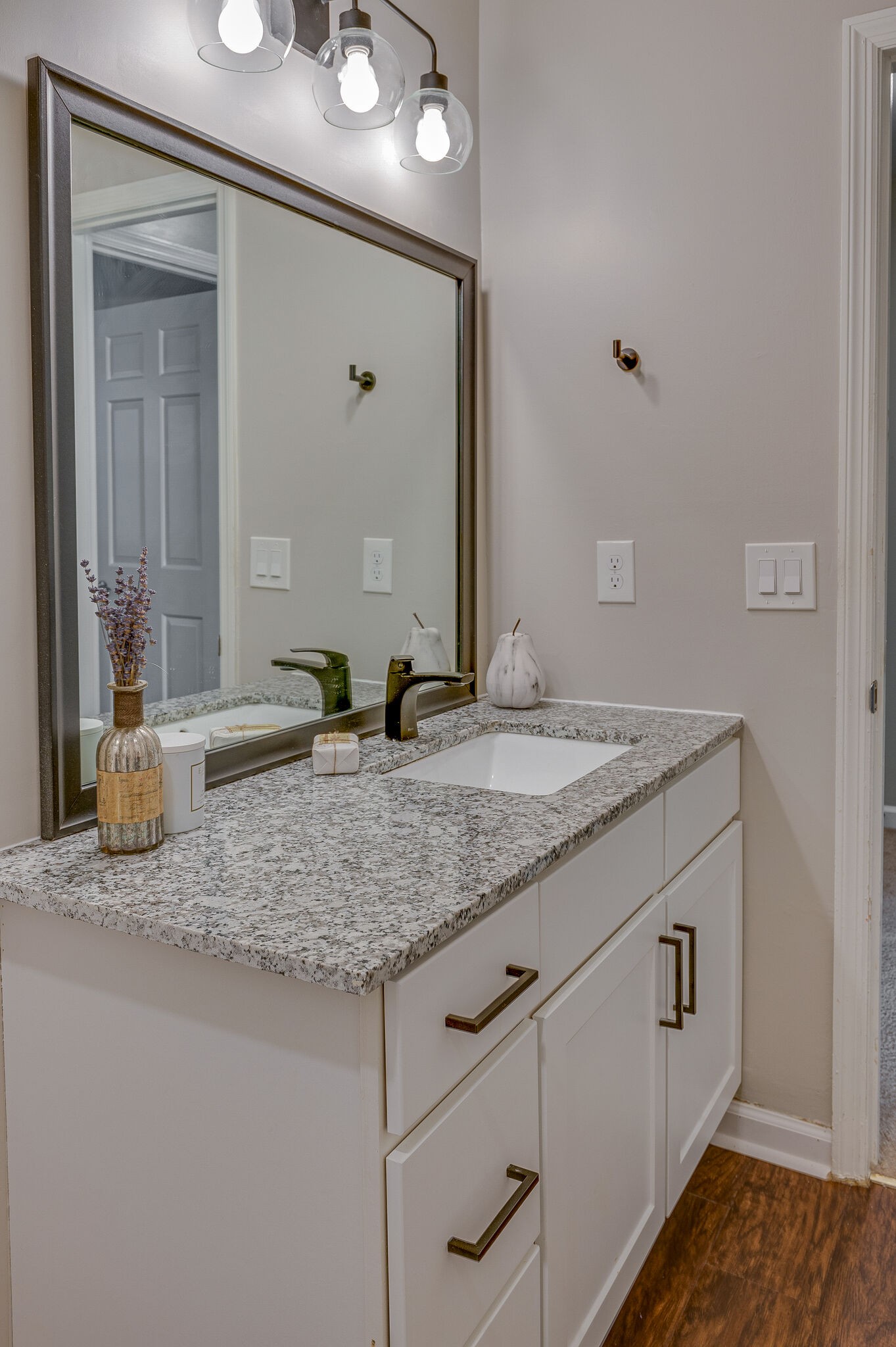 1301 Neelys Bend Road, Unit 90 Madison, TN 37115 - Photo 16 of 17 a bathroom with a granite countertop sink and a mirror