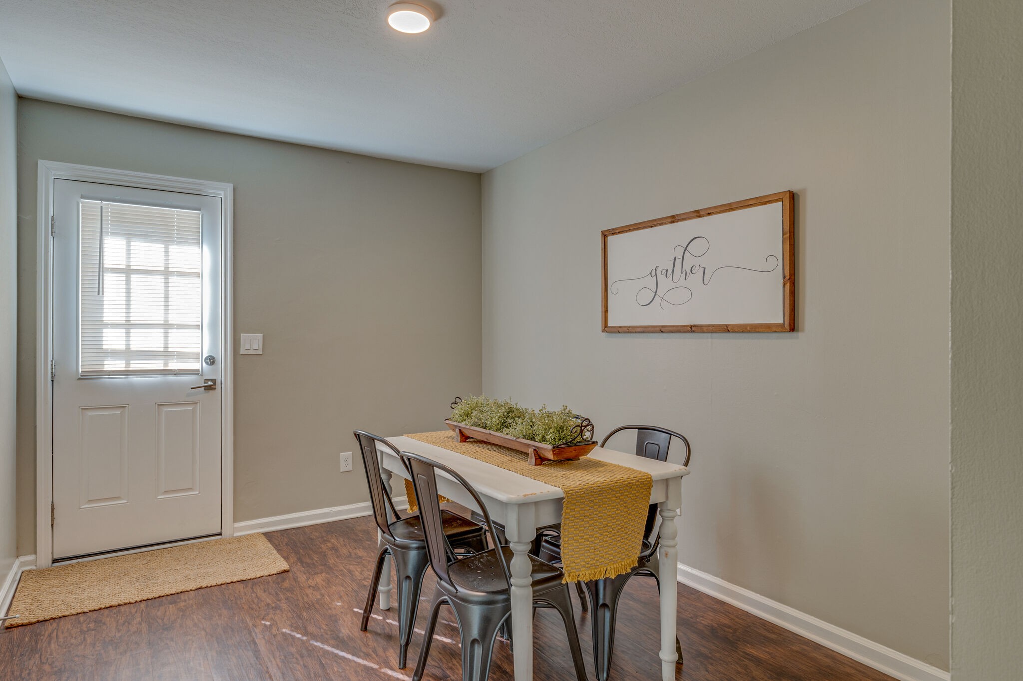 1301 Neelys Bend Road, Unit 90 Madison, TN 37115 - Photo 3 of 17 a view of a dining room with furniture and wooden floor