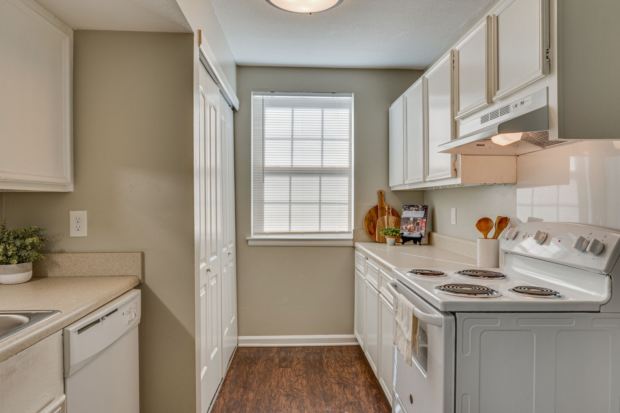 1301 Neelys Bend Road, Unit 90 Madison, TN 37115 - Photo 5 of 17 a kitchen with a sink a stove and cabinets