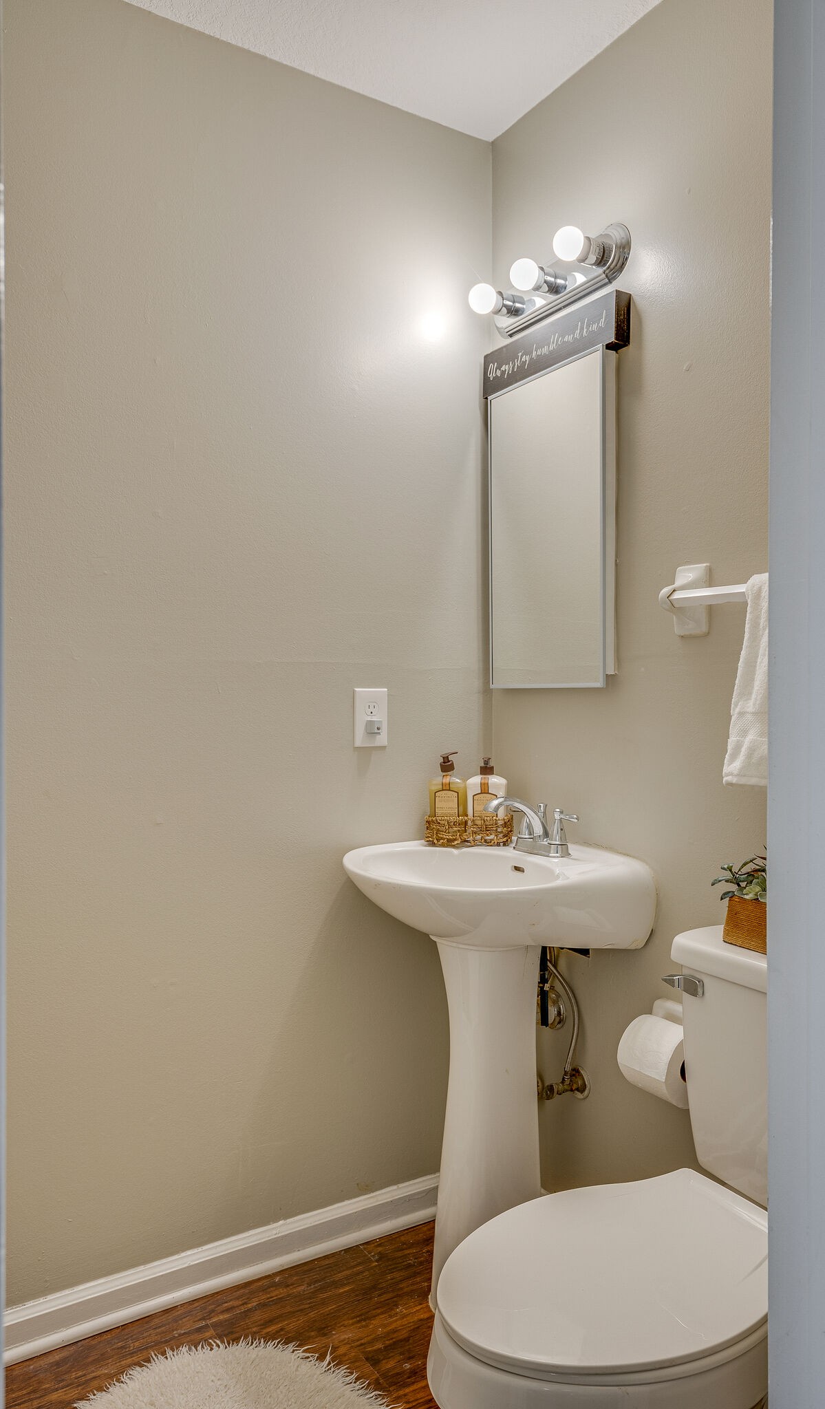 1301 Neelys Bend Road, Unit 90 Madison, TN 37115 - Photo 9 of 17 a bathroom with a sink a toilet and mirror