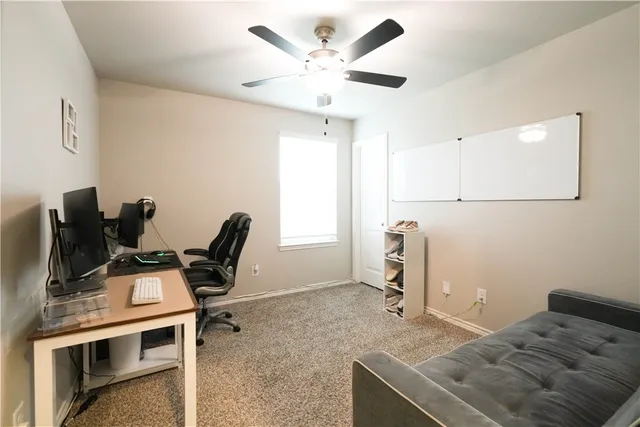 a bedroom with a bed and a desk