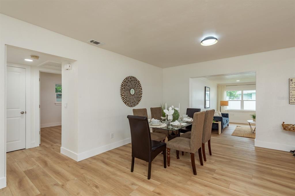 1448 Lemon Street Clearwater, FL 33756 - Photo 12 of 33 a view of a dining room with furniture window and wooden floor