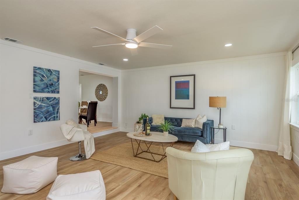 1448 Lemon Street Clearwater, FL 33756 - Photo 16 of 33 a living room with furniture and a painting on the wall