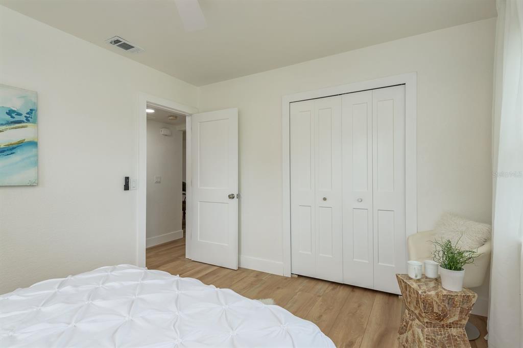 1448 Lemon Street Clearwater, FL 33756 - Photo 19 of 33 a bedroom with a bed and a closet
