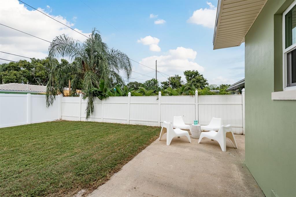 1448 Lemon Street Clearwater, FL 33756 - Photo 26 of 33 a view of a chair and tables in the house
