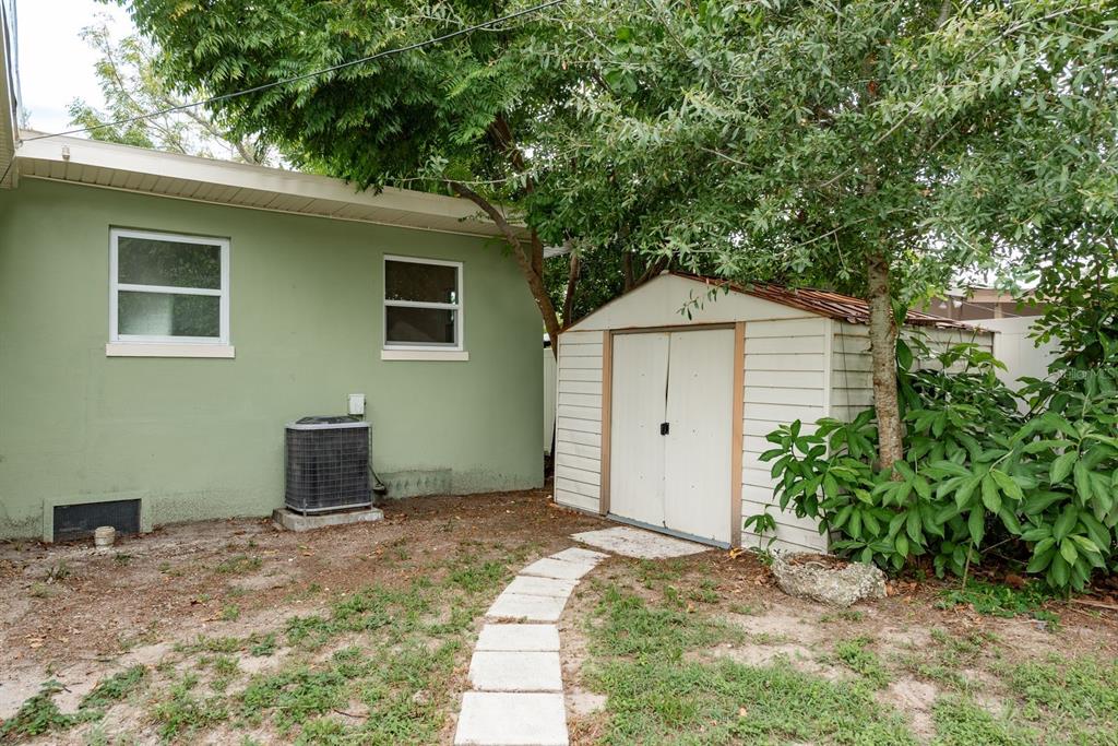 1448 Lemon Street Clearwater, FL 33756 - Photo 31 of 33 a backyard of a house with seating space