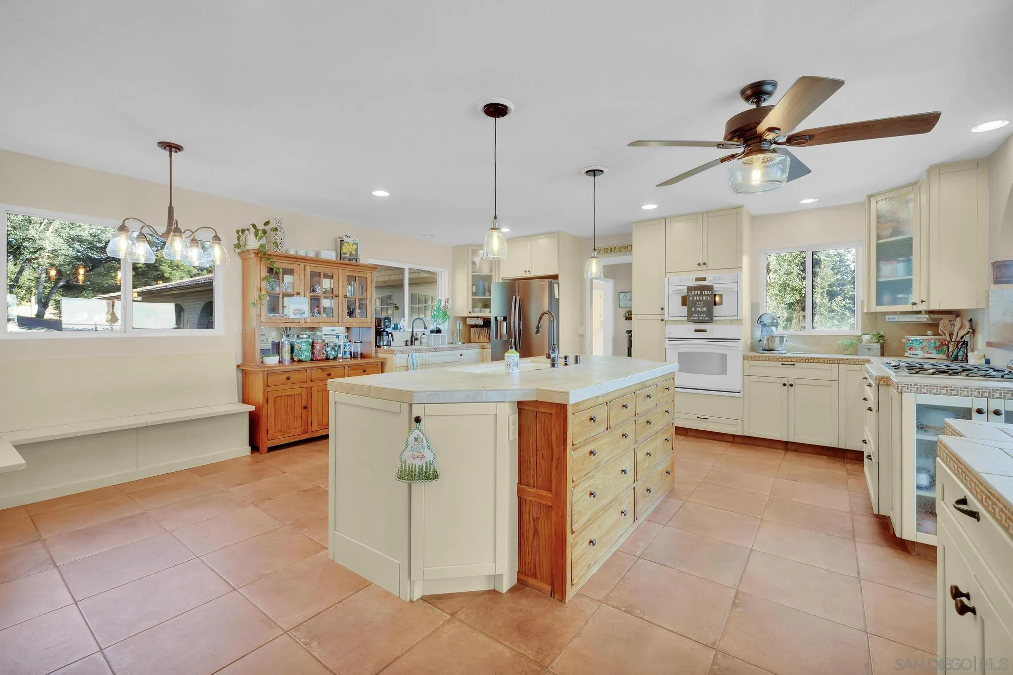 1634 Oakforest Road Santa Ysabel, CA 92070 - Photo 13 of 61 a kitchen with kitchen island cabinets and chandelier