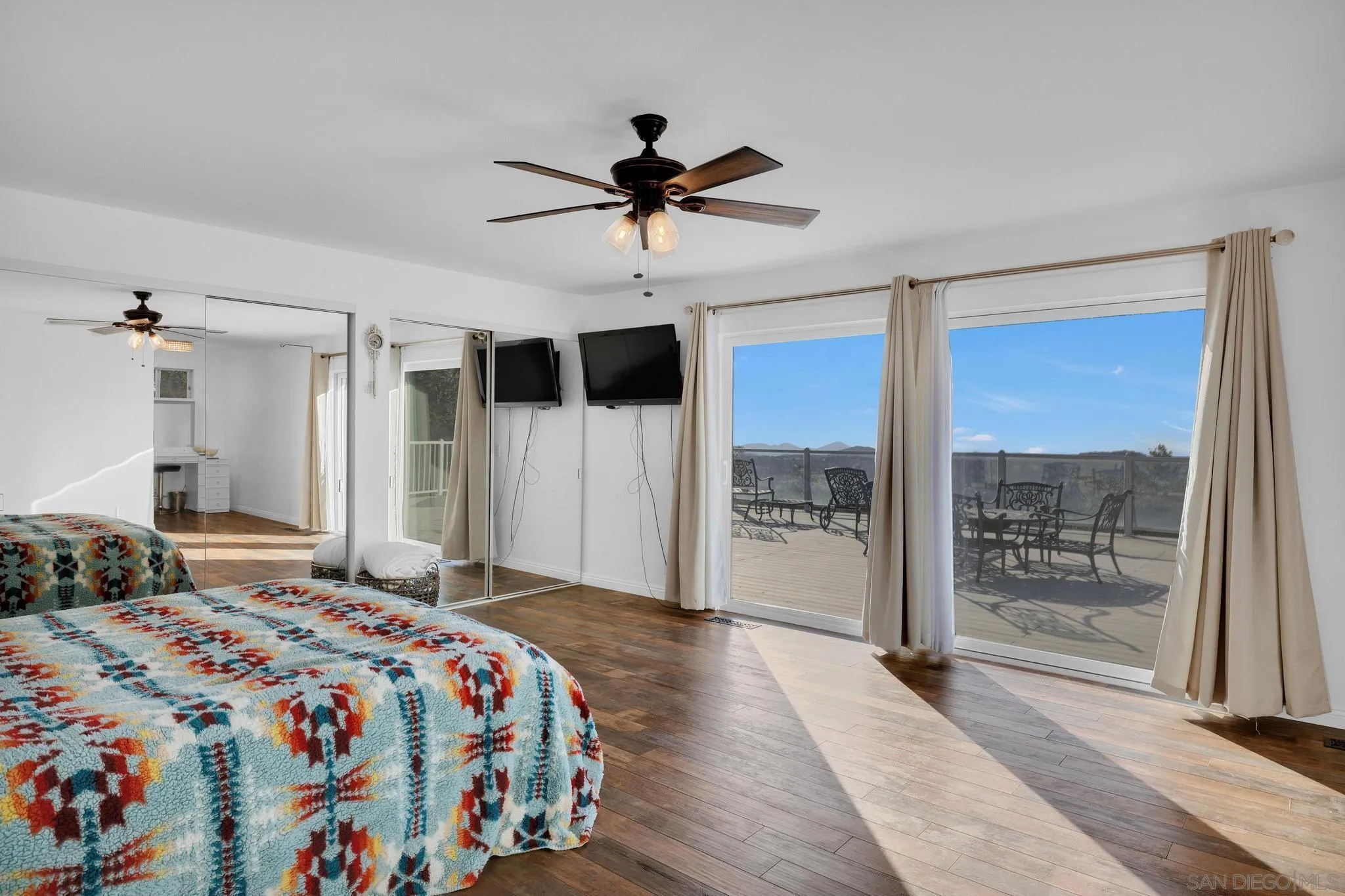1634 Oakforest Road Santa Ysabel, CA 92070 - Photo 21 of 61 a bedroom with a bed and a large window