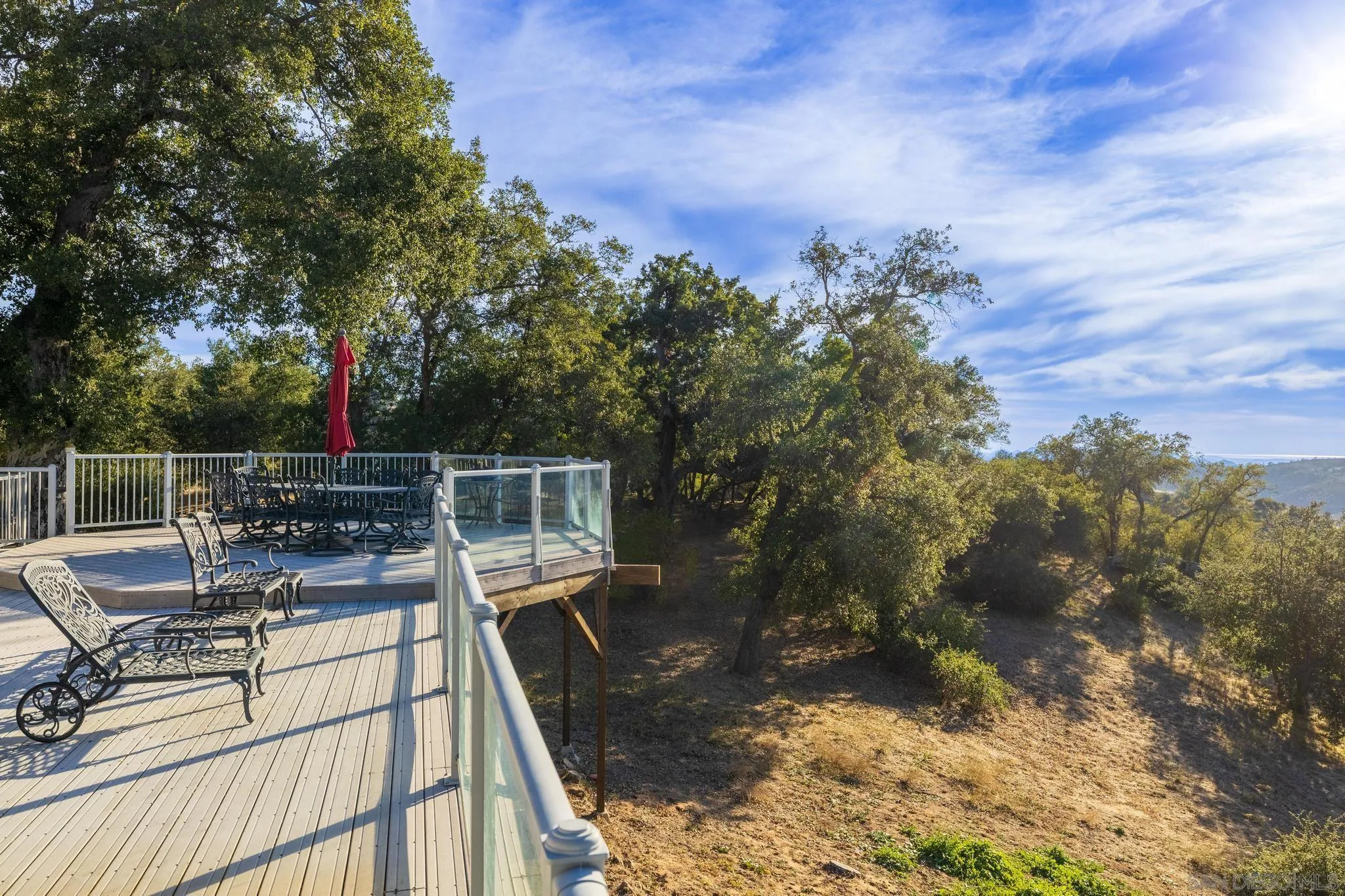 1634 Oakforest Road Santa Ysabel, CA 92070 - Photo 26 of 61 a view of a balcony with two chairs and a table