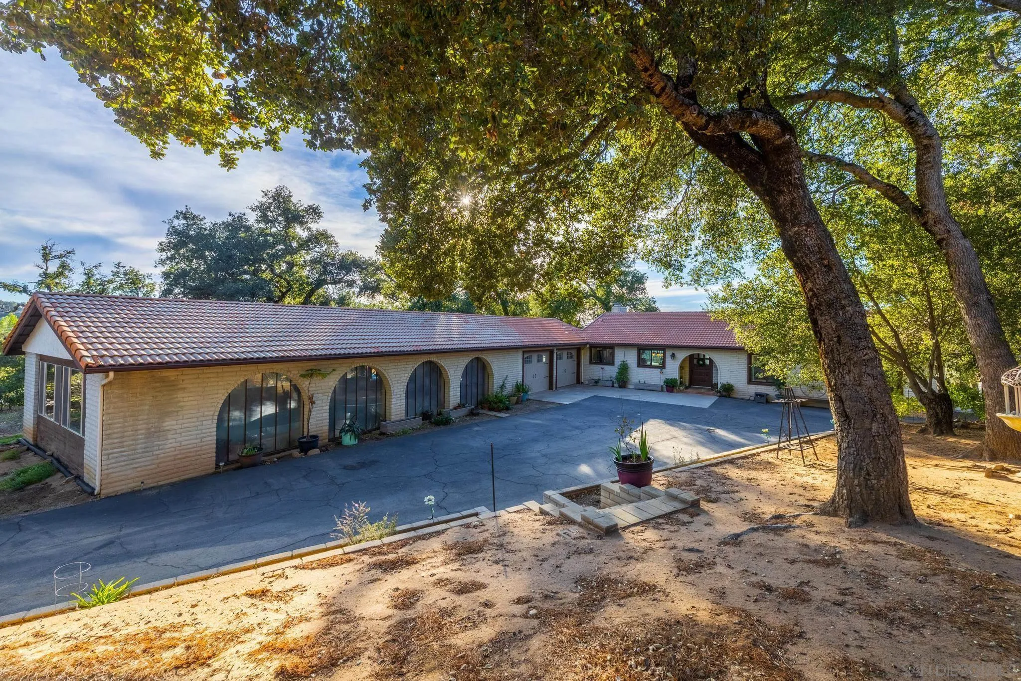 1634 Oakforest Road Santa Ysabel, CA 92070 - Photo 3 of 61 a view of a house with backyard and a tree