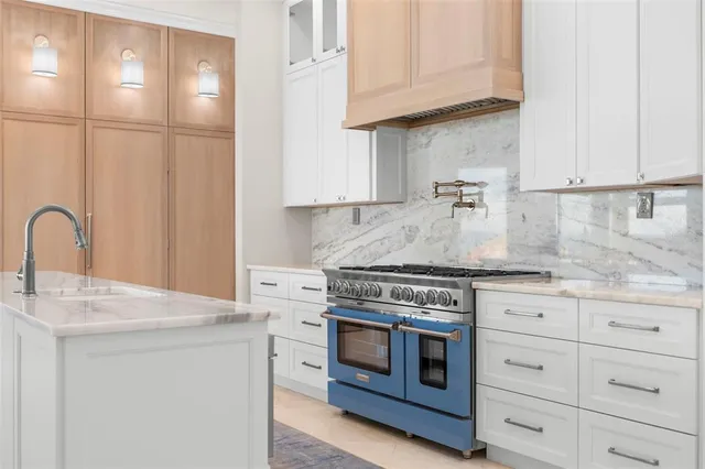 a view of a backyard with a patio and fire pit