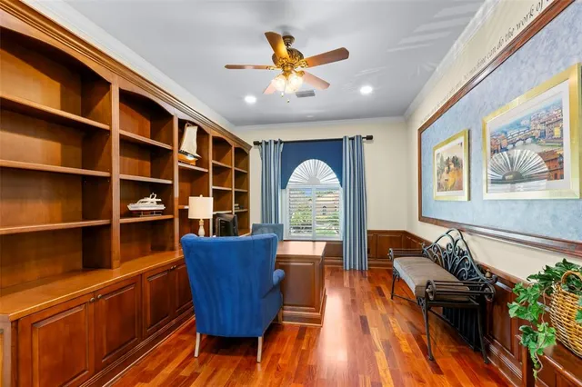 a dining room with furniture and wooden floor