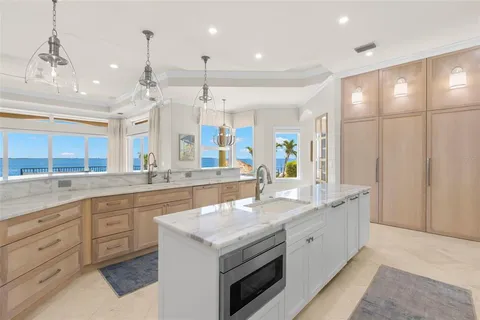 a backyard of a house with lawn chairs