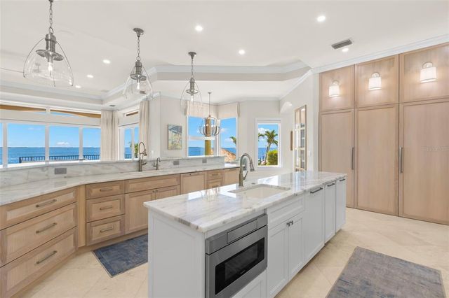 a backyard of a house with lawn chairs