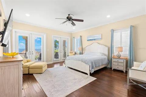 a view of a swimming pool with a patio and plants