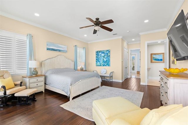 an aerial view of a house with outdoor space pool seating area