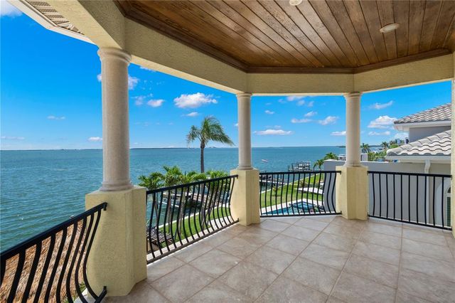 a view of a brick building next to a yard