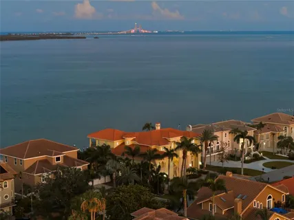 a large kitchen with a large counter top appliances and cabinets