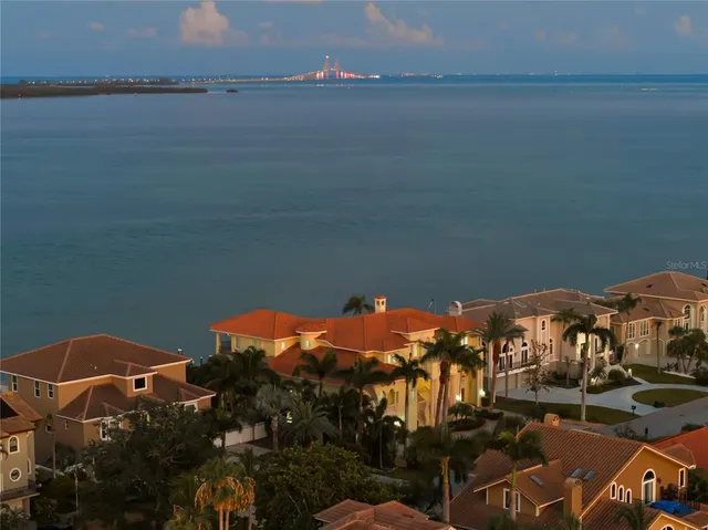 a large kitchen with a large counter top appliances and cabinets