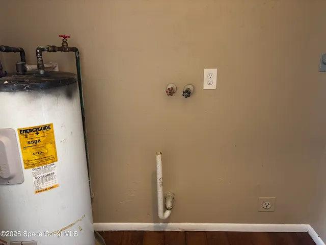 an empty room with wooden floor and closet