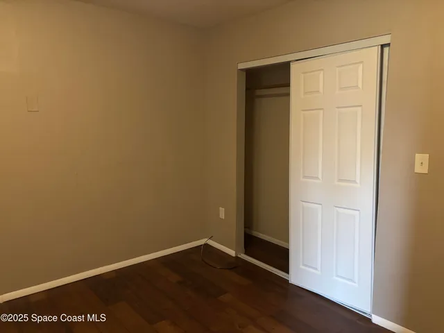 a kitchen with a sink a stove and cabinets