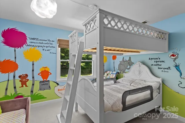 a bedroom with furniture and a window