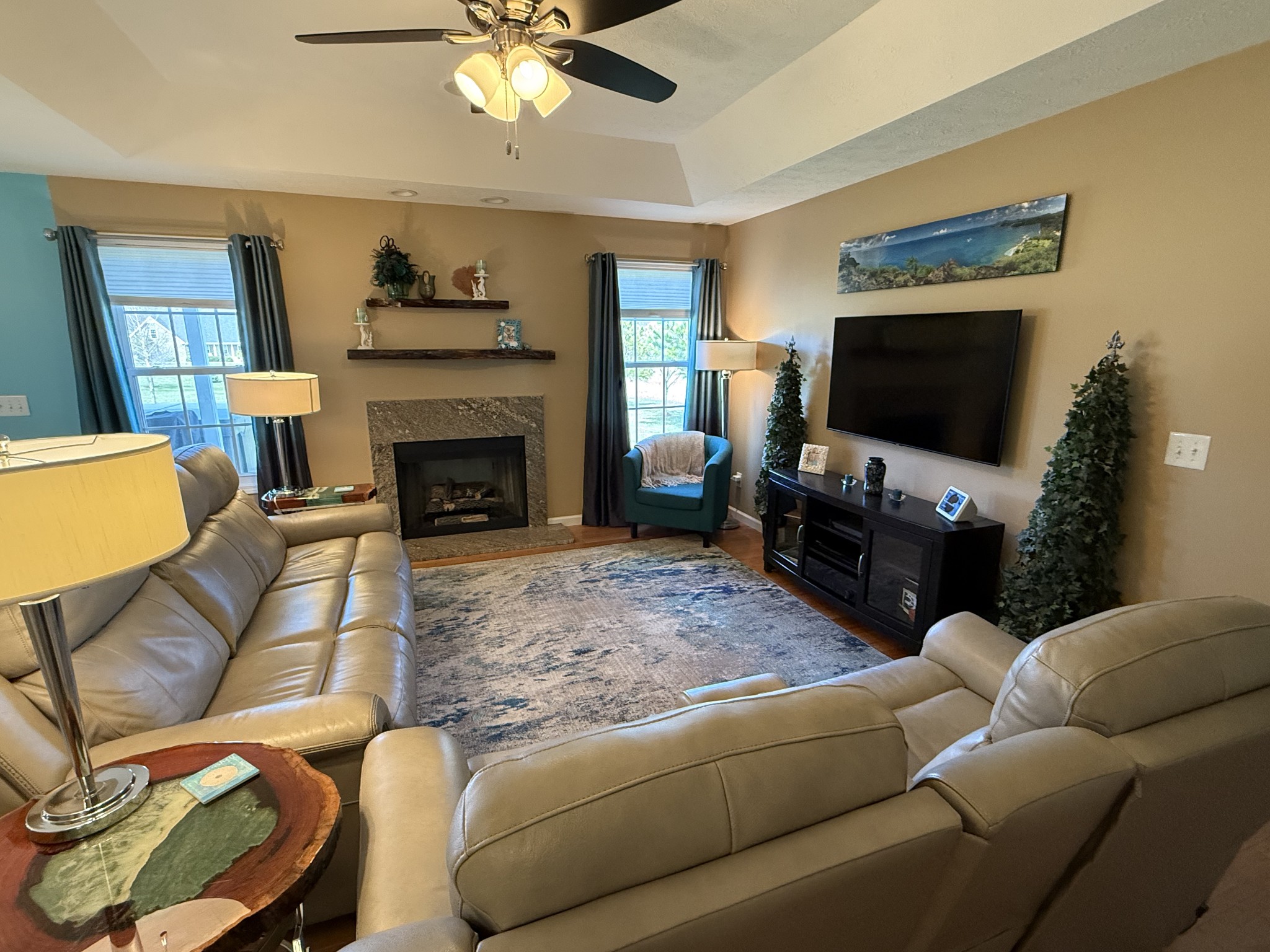 330 North Centerpoint Road Portland, TN 37148 - Photo 12 of 28 a living room with furniture a flat screen tv and a fireplace