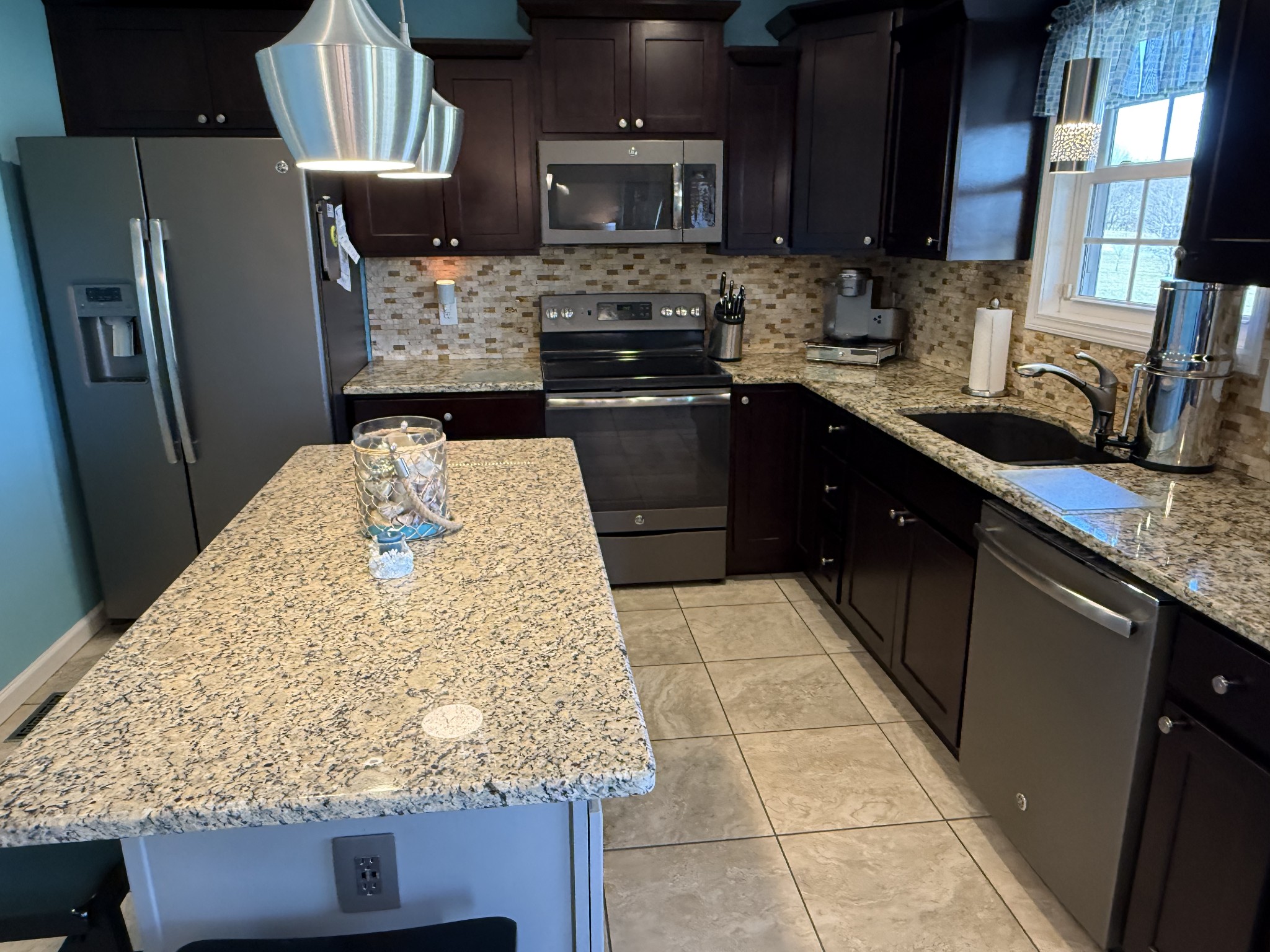 330 North Centerpoint Road Portland, TN 37148 - Photo 15 of 28 a kitchen with a sink refrigerator and microwave