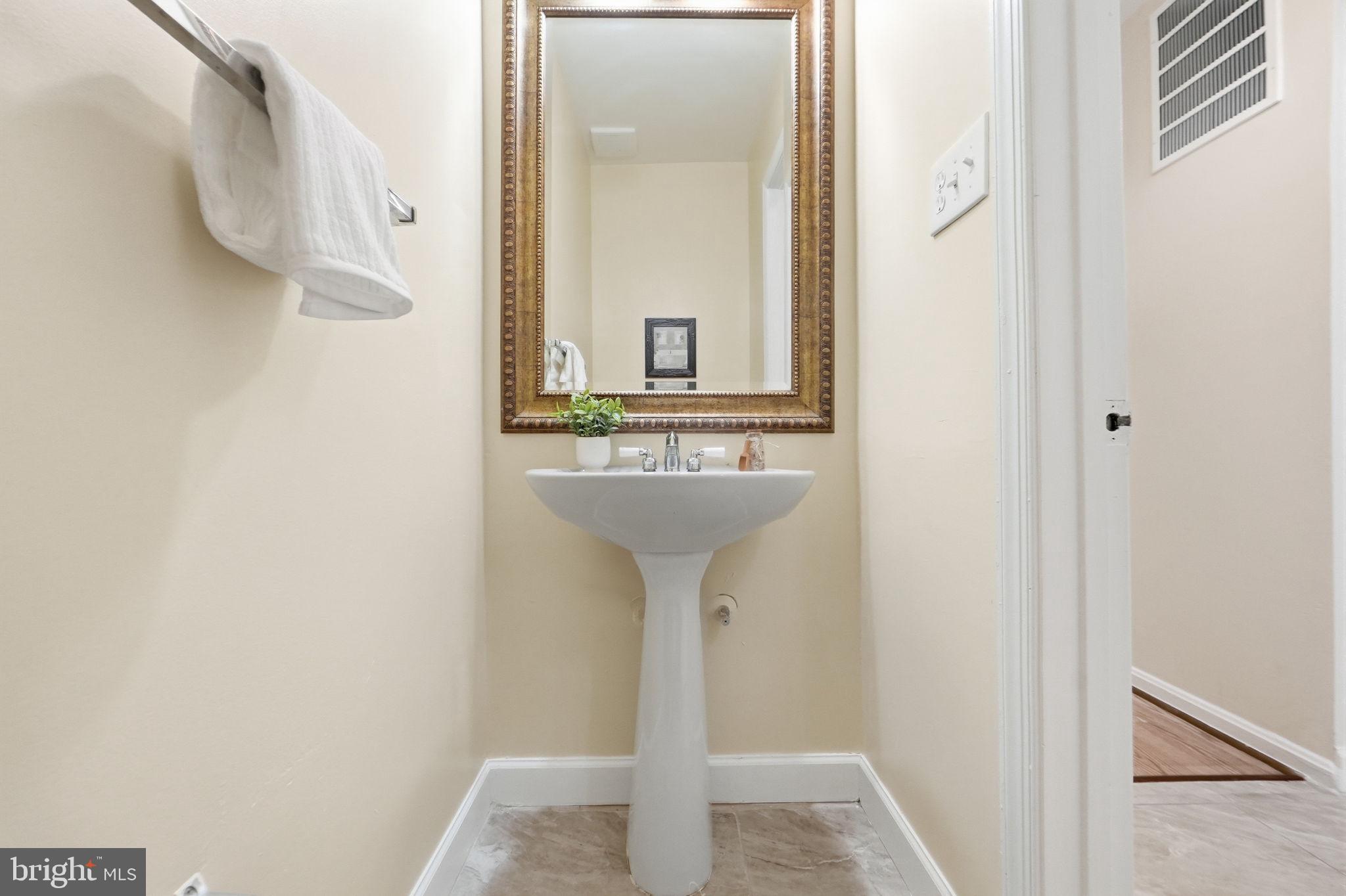 6470 Franconia Court Springfield, VA 22150 - Photo 10 of 31 a bathroom with a sink and a mirror