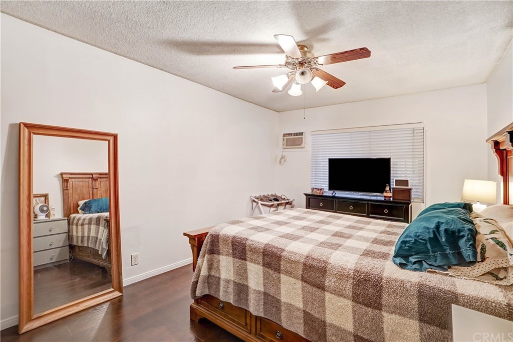 10223 25th Street Rancho Cucamonga, CA 91730 - Photo 13 of 17 a bedroom with a bed and a flat screen tv